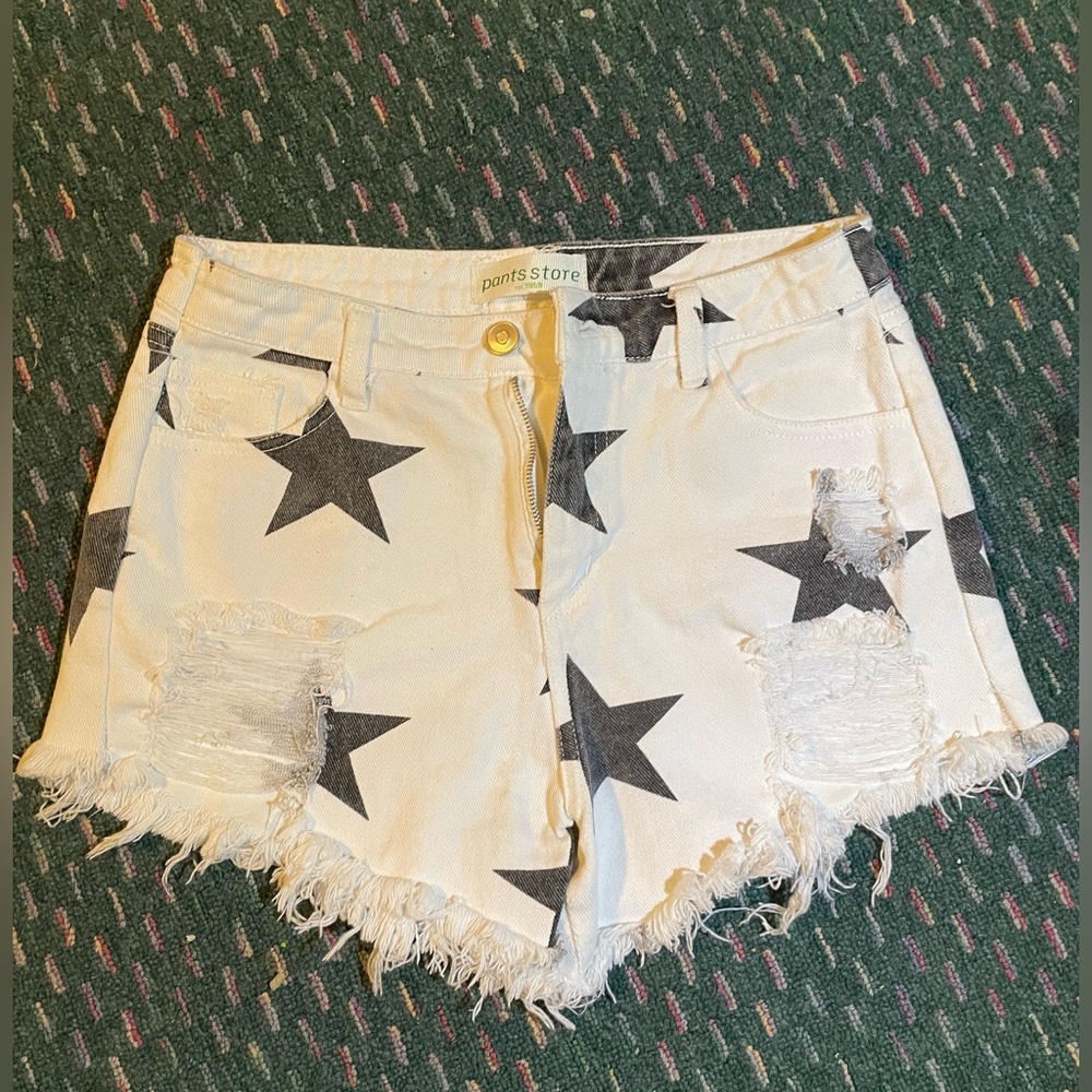 White with black stars ripped Jean shorts